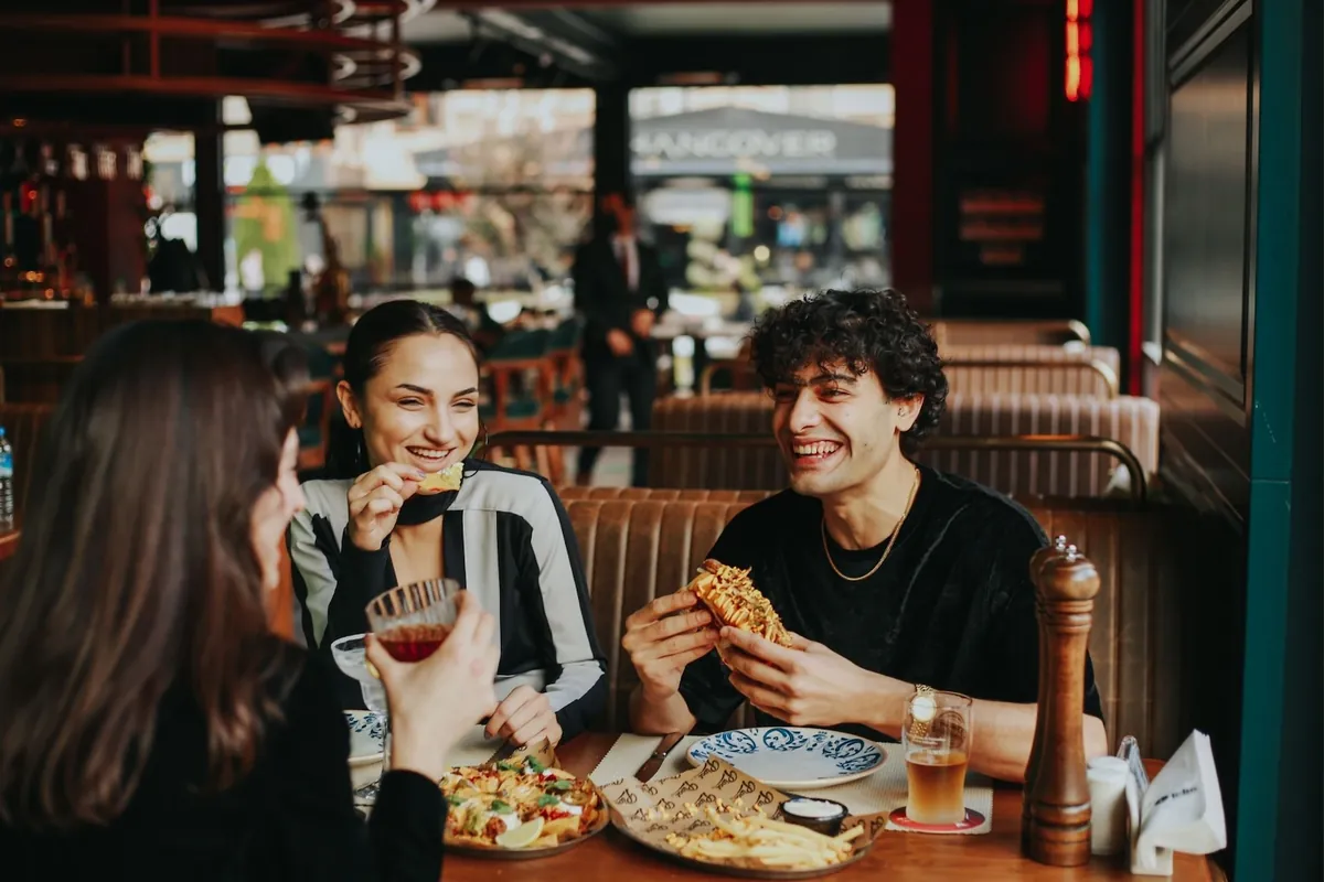 Students sharing a meal at a local restaurant